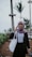woman in black and white long sleeve shirt holding white paper bag