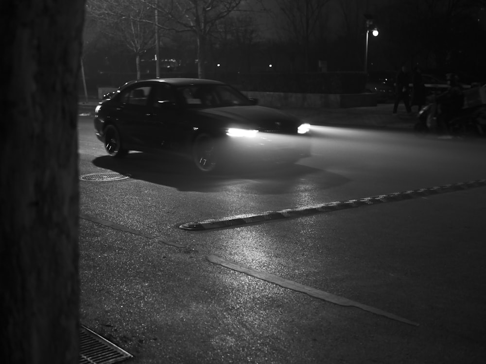 grayscale photo of cars on road