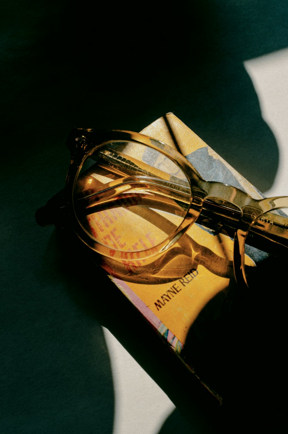 black framed eyeglasses on brown and black box