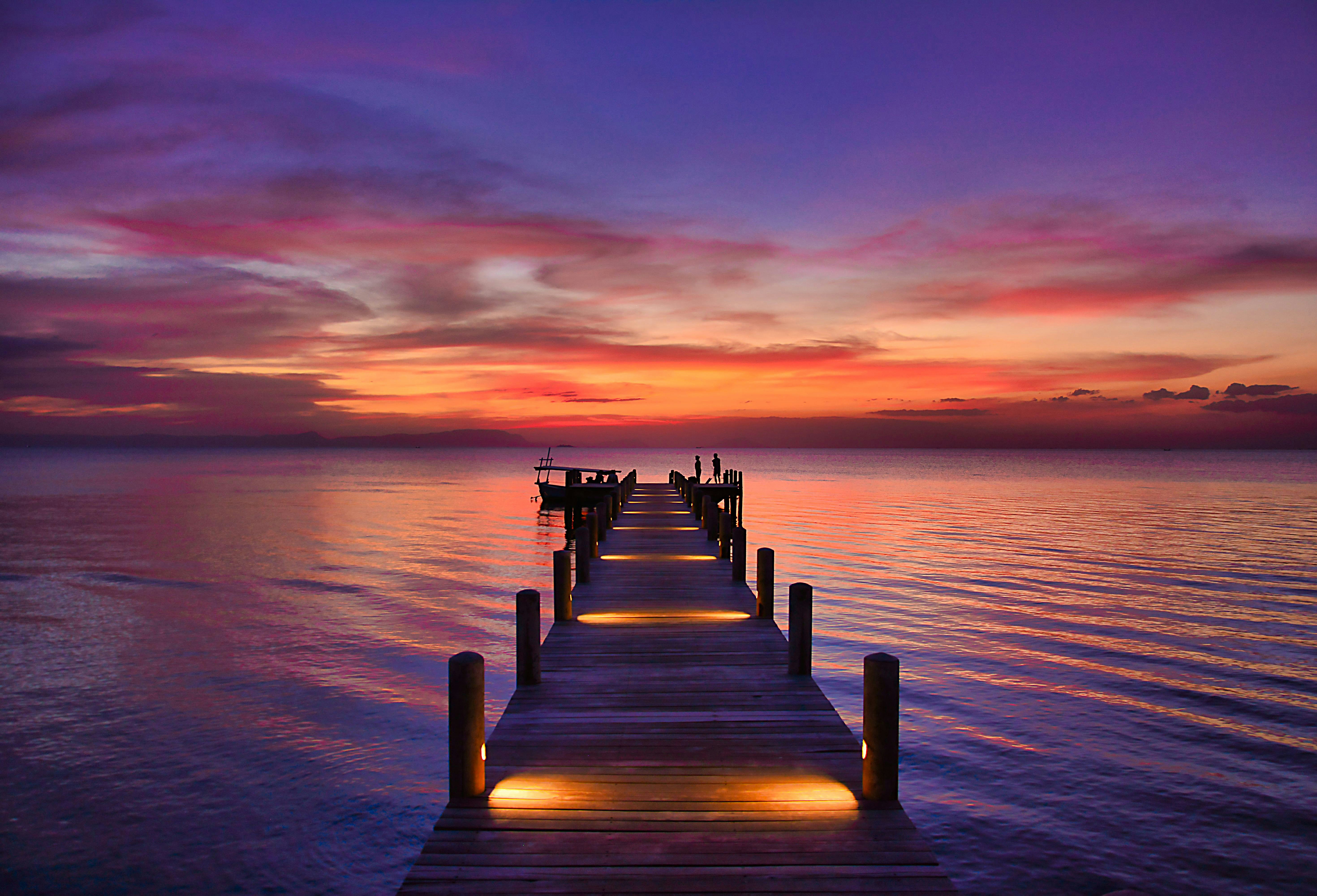 brown wooden dock on sea during sunset, 