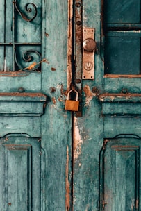 blue wooden door with padlock