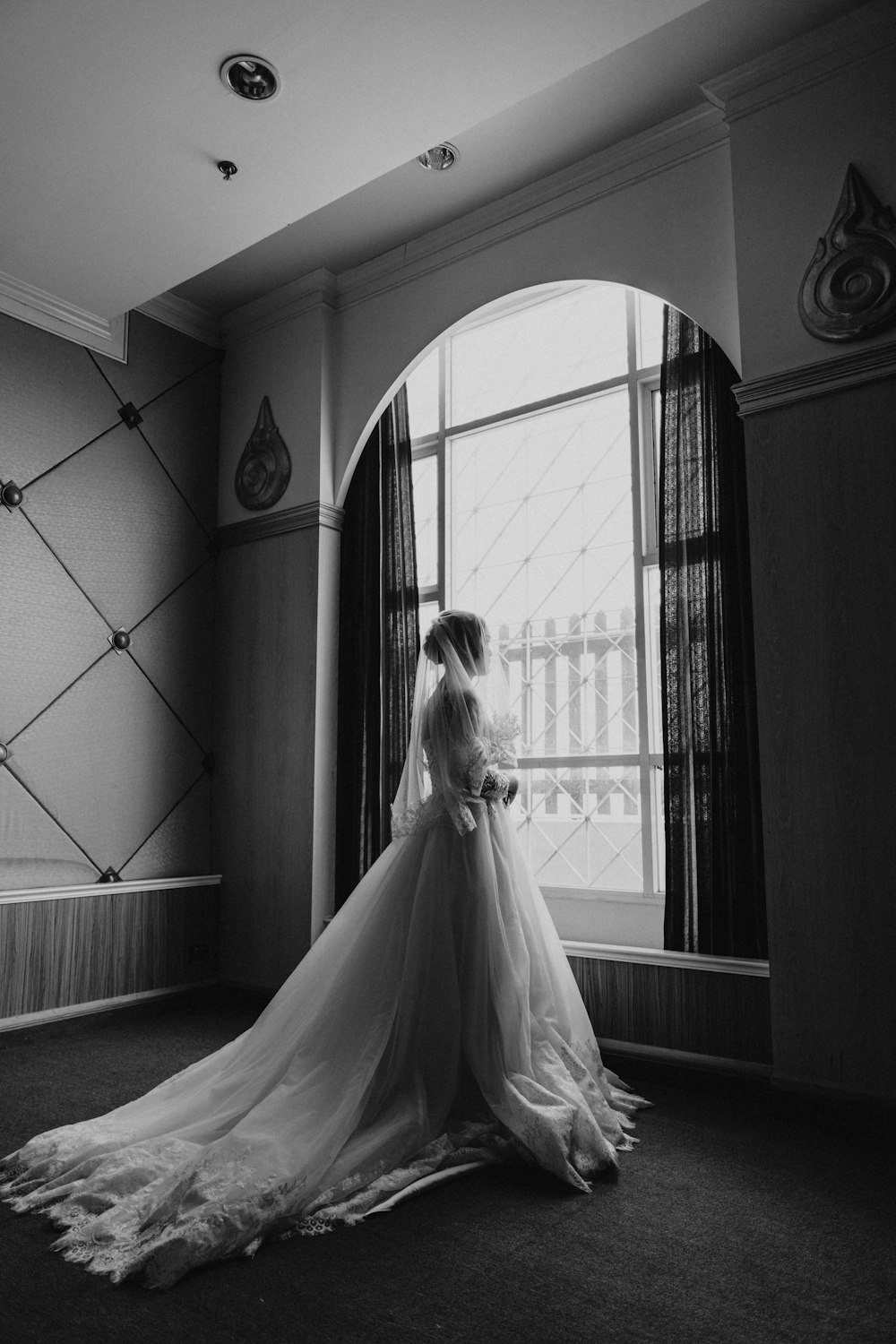 grayscale photo of woman in wedding gown