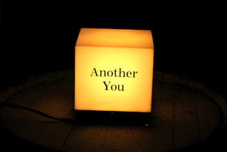 A glowing illuminated 3D map with a personalized message, set against a dark art deco backdrop.