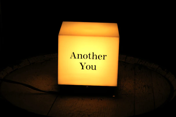 A glowing illuminated 3D map with a personalized message, set against a dark art deco backdrop.