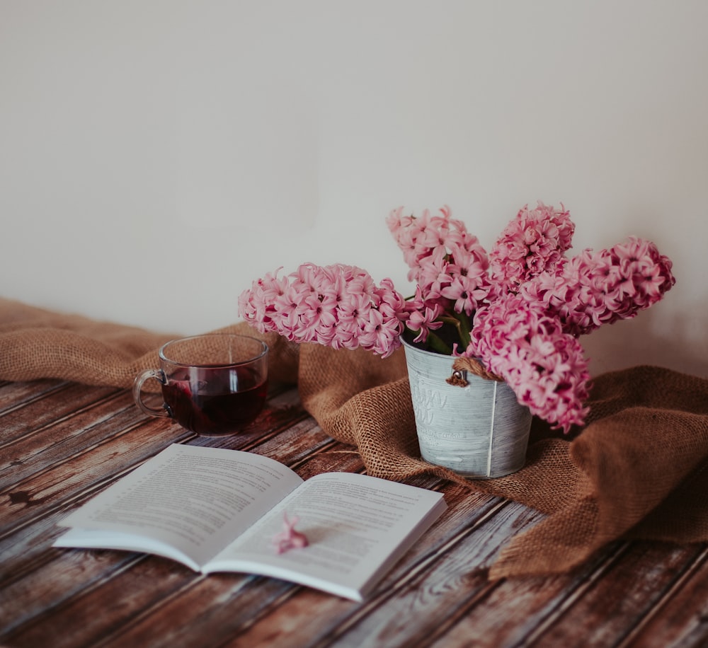 pink flowers on white ceramic vase