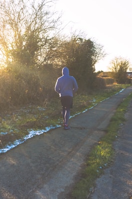 Athlete wearing a breathable Apex Athletics jacket during a morning run.
