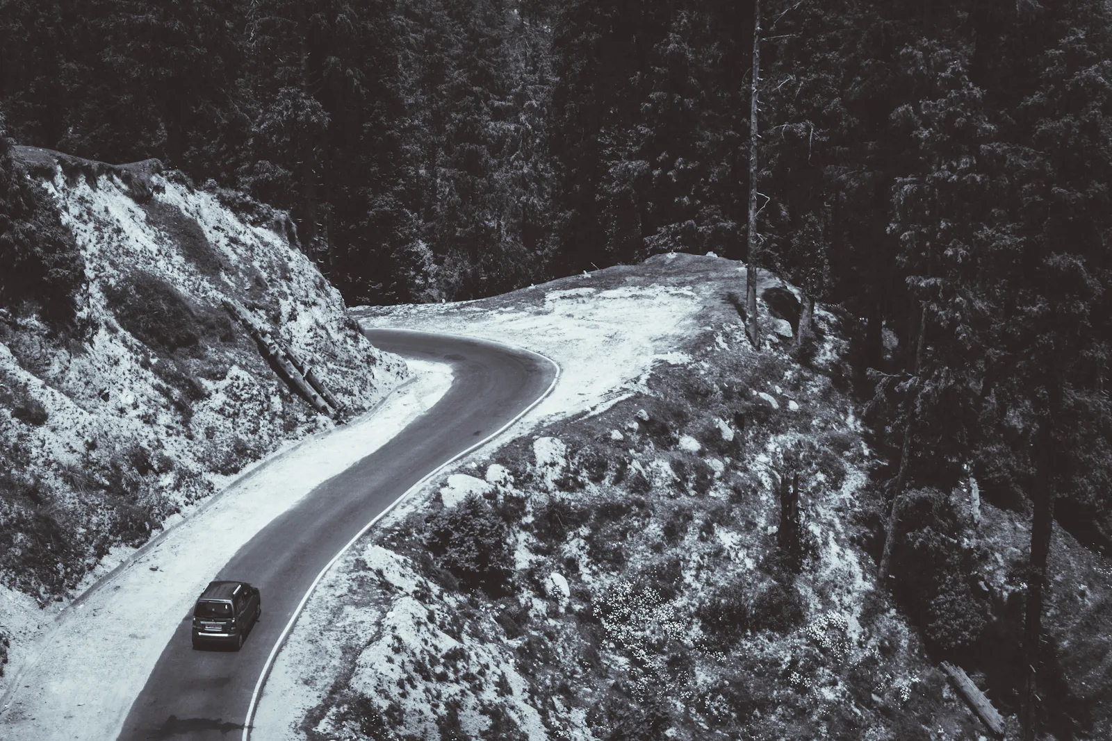 Car on a snowy Himachal mountain road