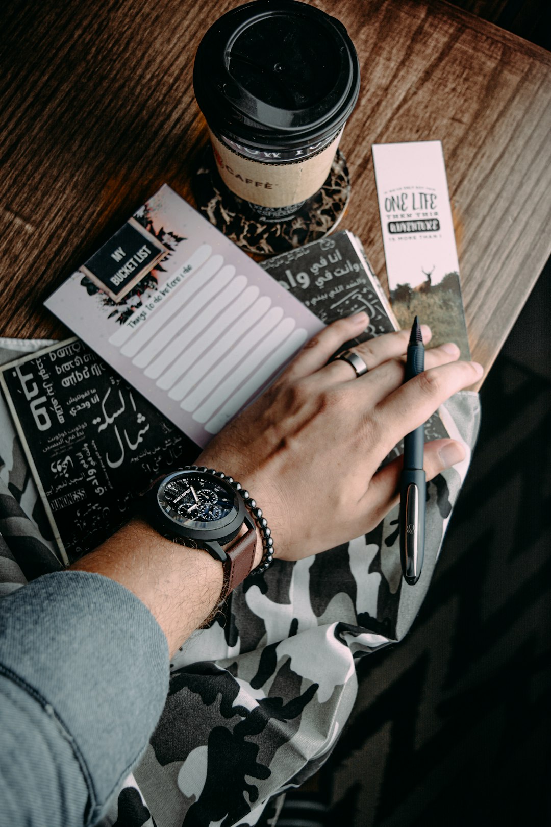 person writing on white paper