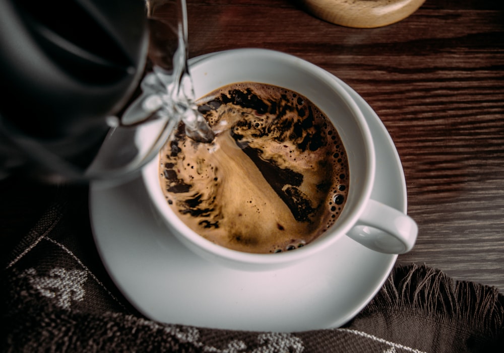 white ceramic mug with coffee