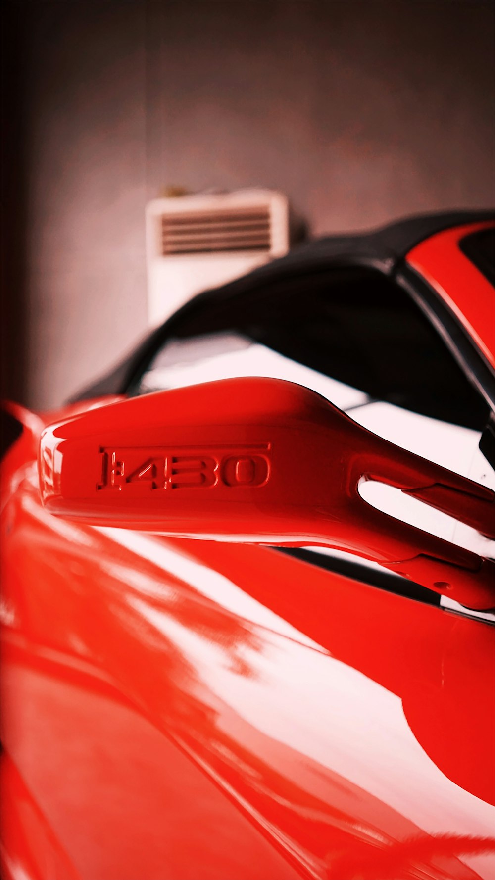 a close up of a pair of scissors on a red car