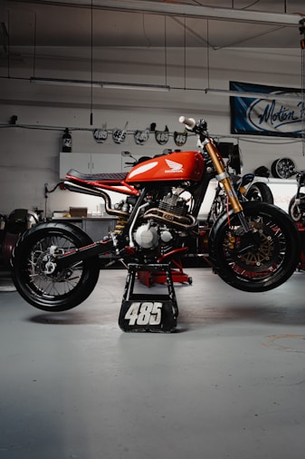 red and black sports bike