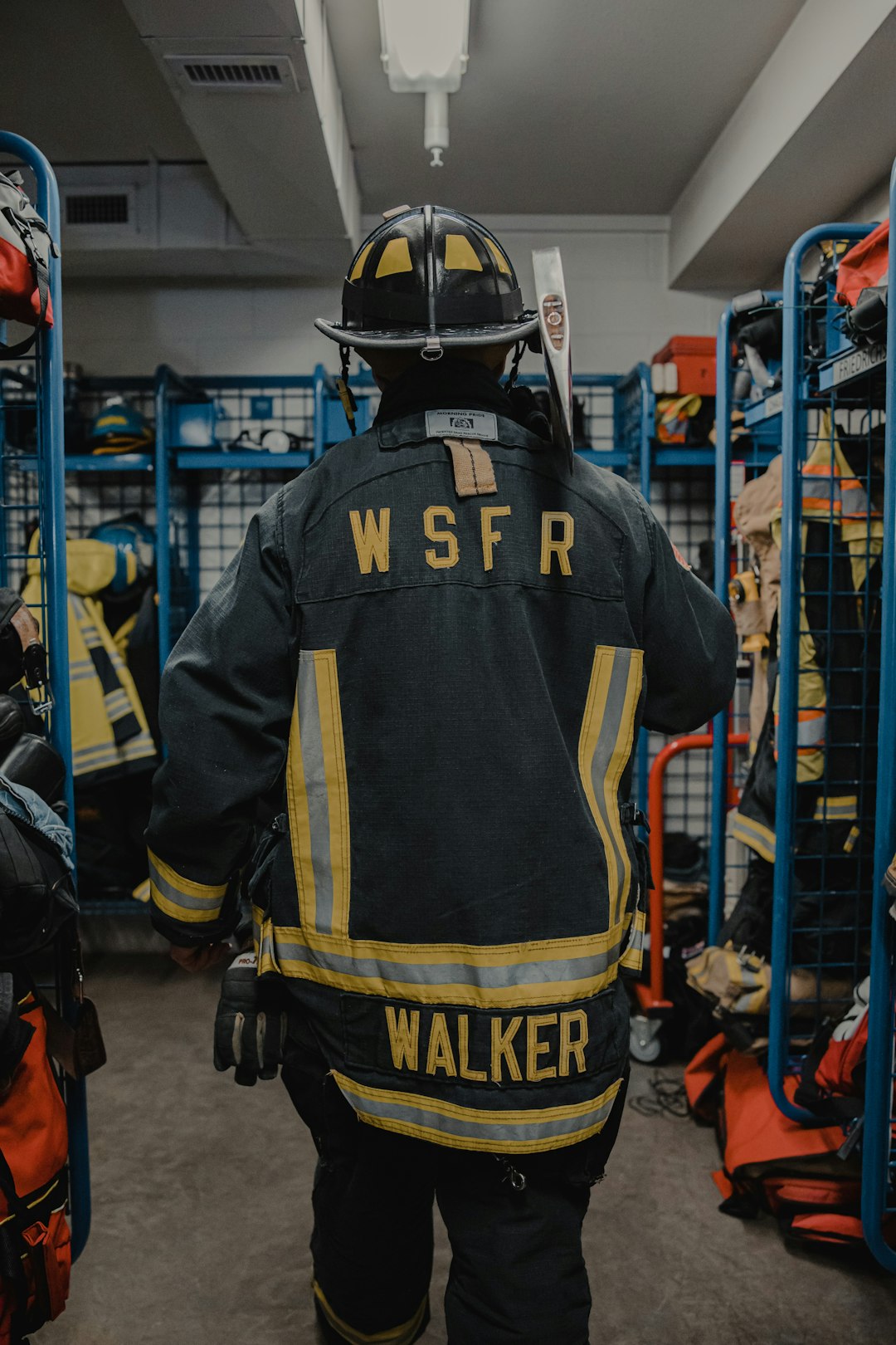 man in blue and yellow jersey shirt wearing helmet