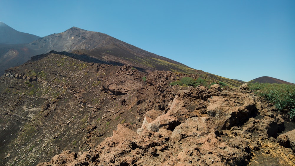 green and brown mountain under blue sky during daytime