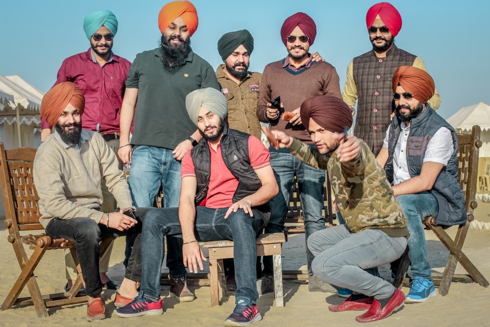 group of men sitting on bench