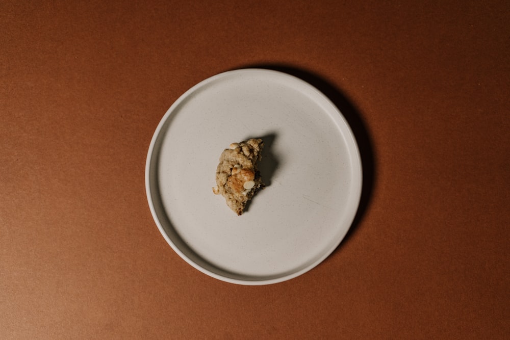 brown food on white ceramic plate