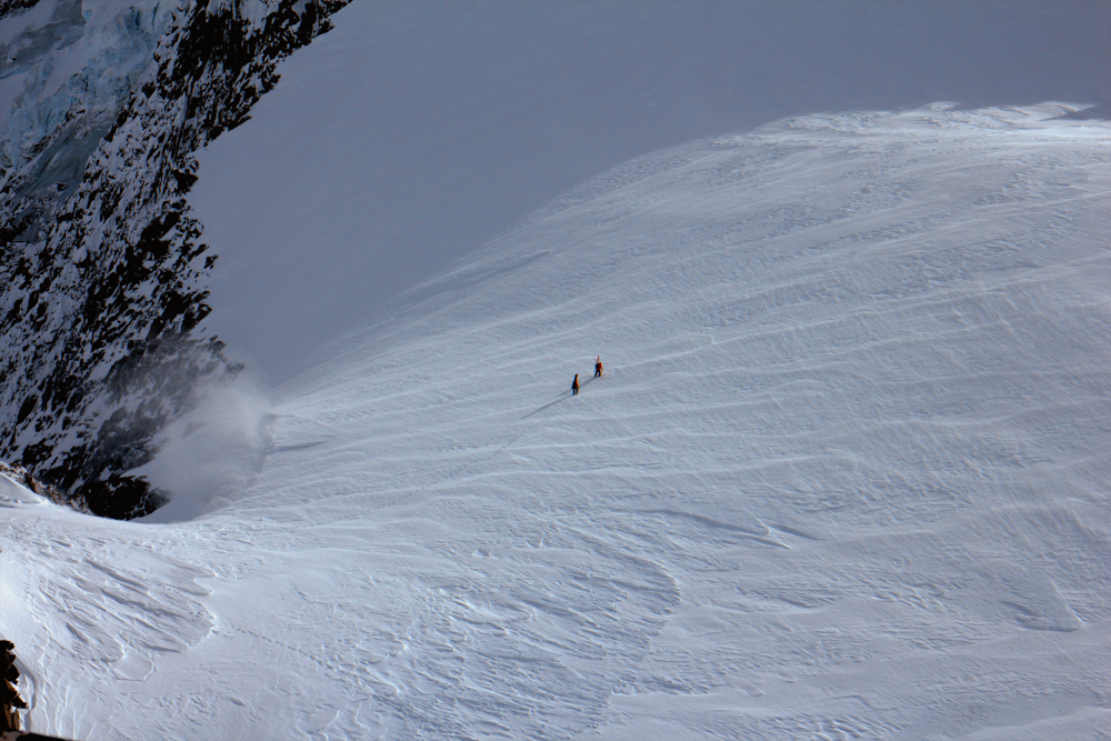 person in white snow covered mountain during daytime