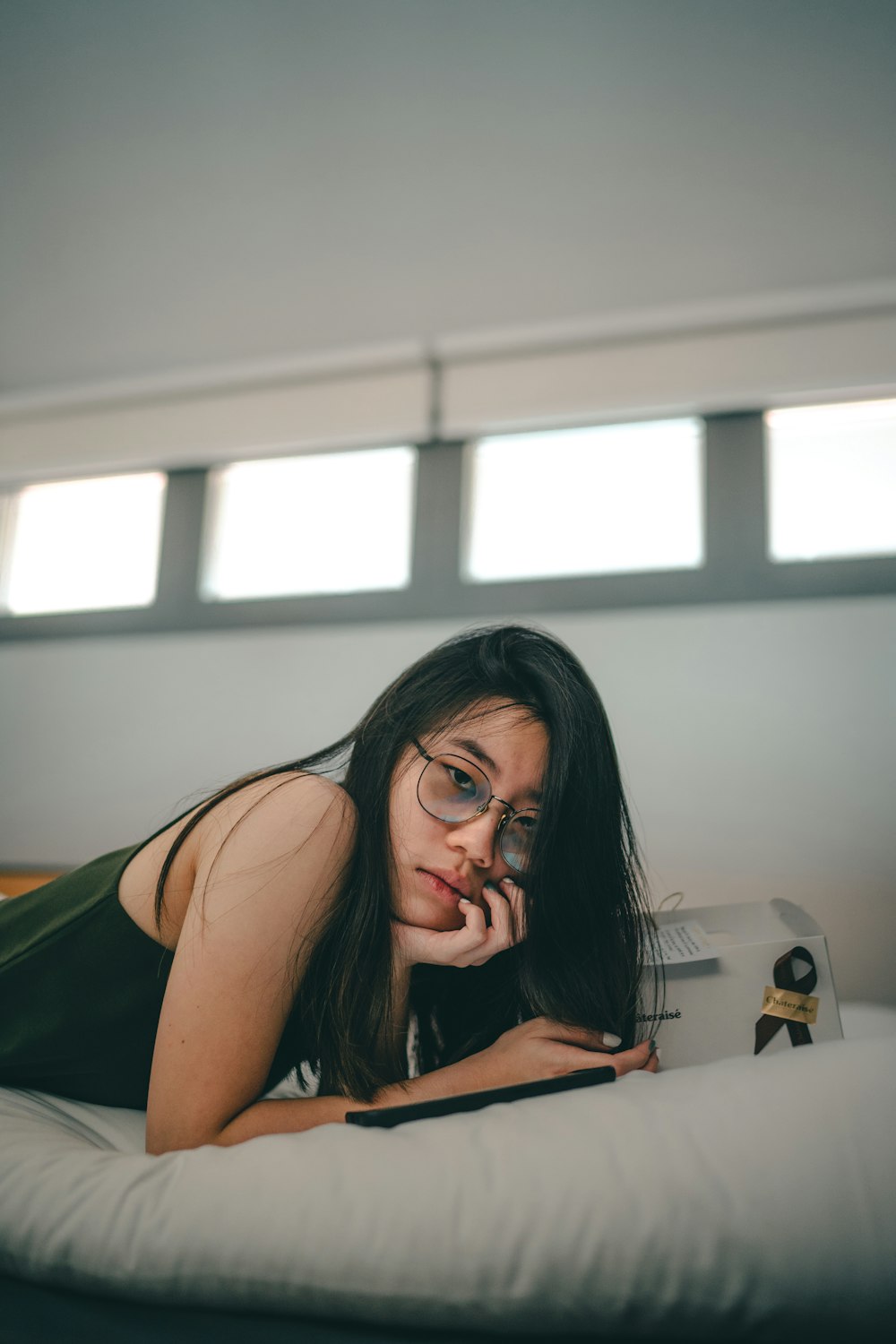 woman in black tank top wearing eyeglasses