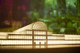 High-resolution shot of a detailed 3D-printed architectural model with liquid glass effect.