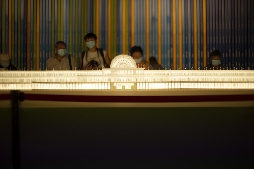 people sitting on chair in front of stage