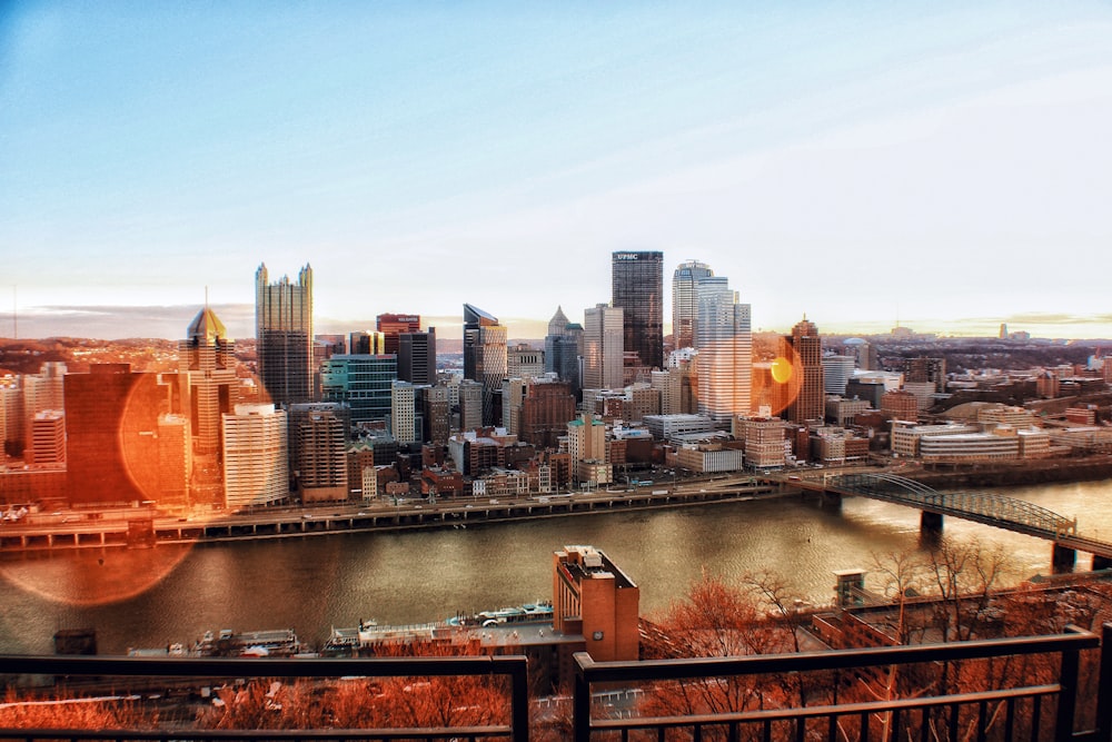 a view of a city with a bridge in the foreground