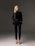 woman in black long sleeve shirt and black pants