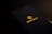 A smartphone screen displaying the Binance logo with yellow text and an icon in the center against a dark background.