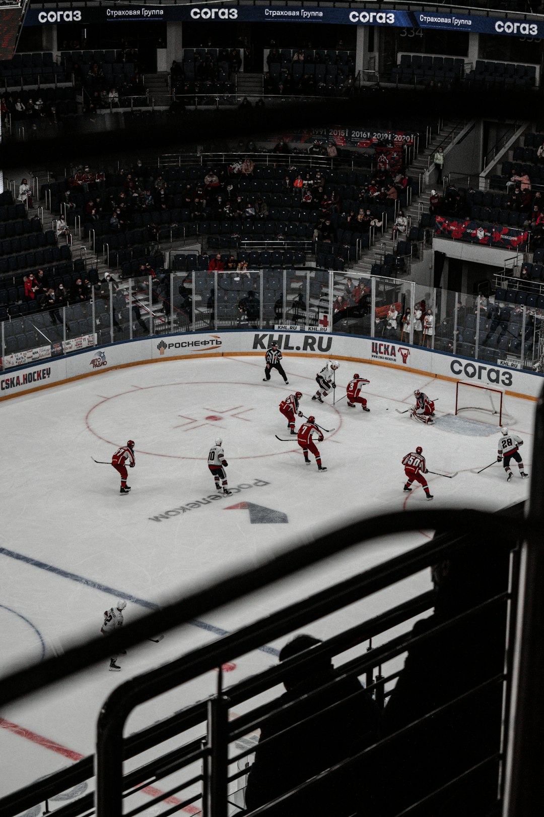 people playing ice hockey on ice stadium