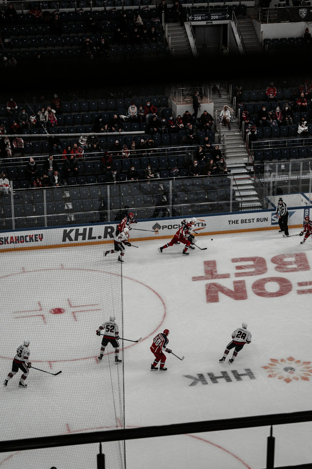 people playing ice hockey on stadium