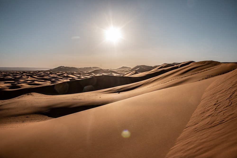 brown sand under blue sky during daytime