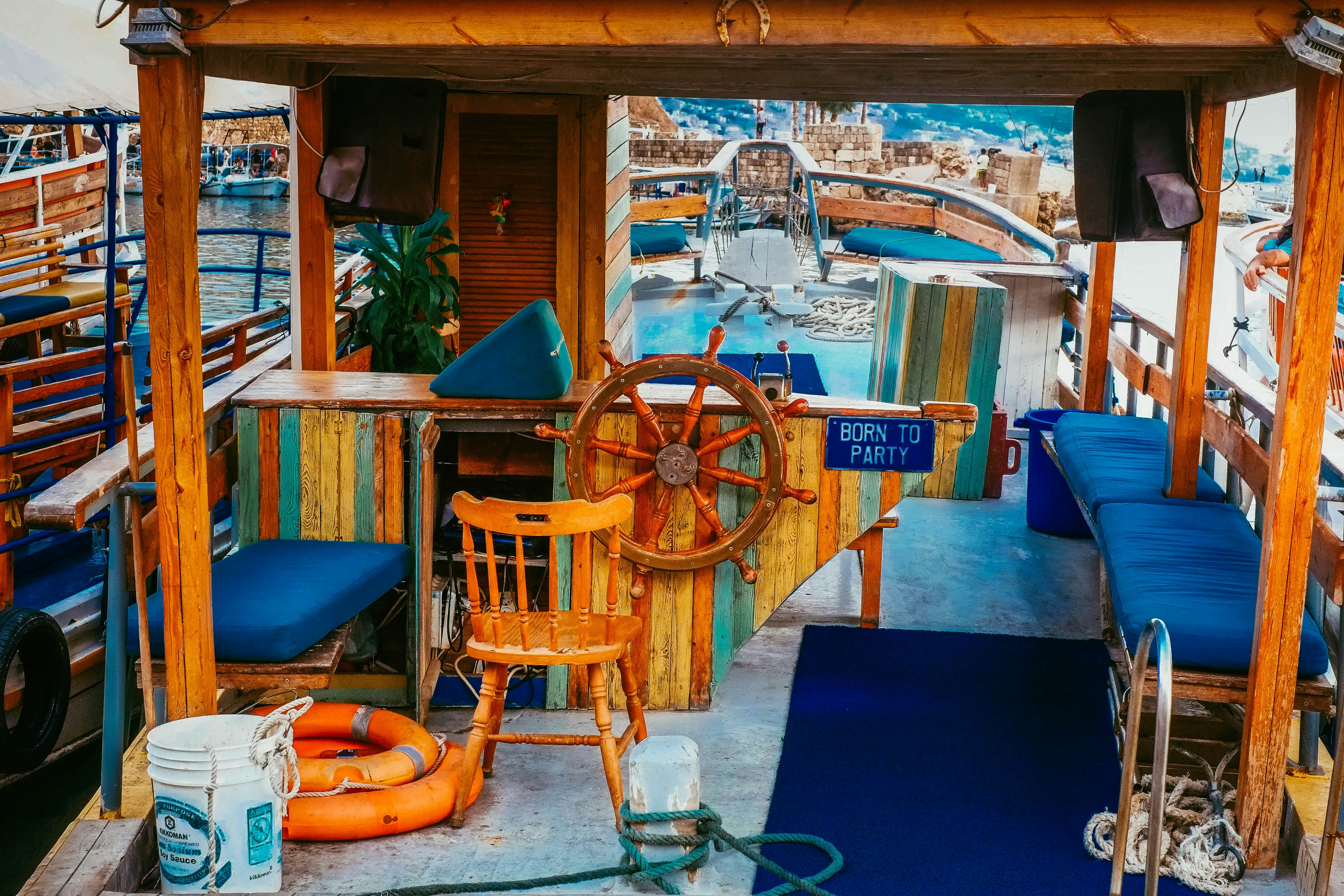 brown wooden chair near blue table