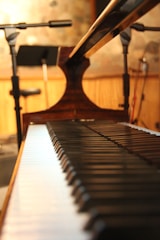 David Keys rehearsing in a cozy studio surrounded by sheet music.