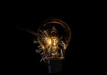 a light bulb that is turned on in the dark