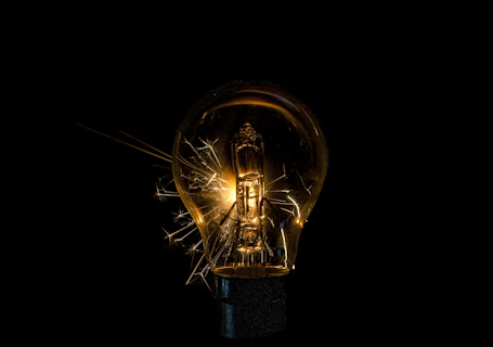 a light bulb that is turned on in the dark
