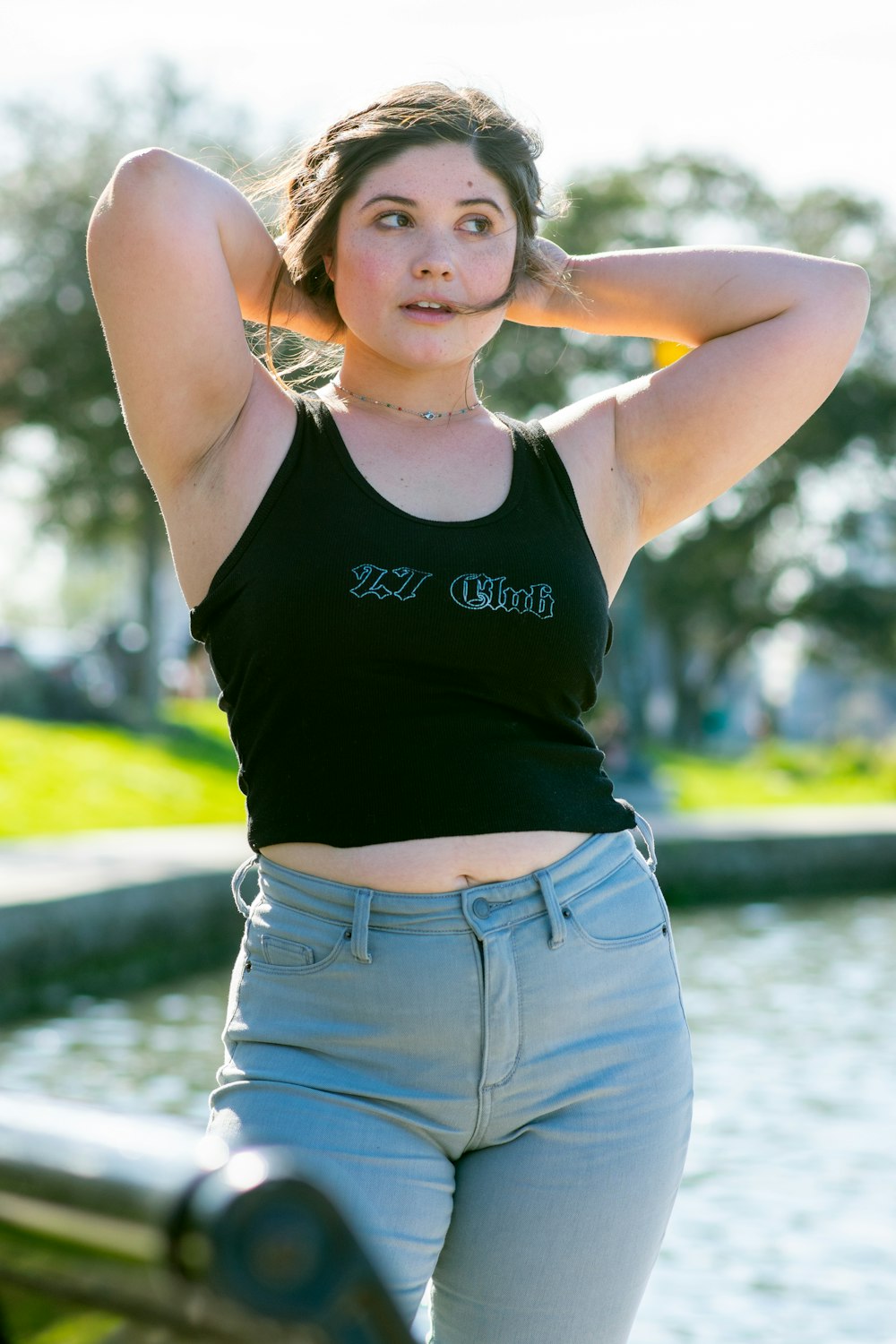 woman in black tank top and blue denim shorts