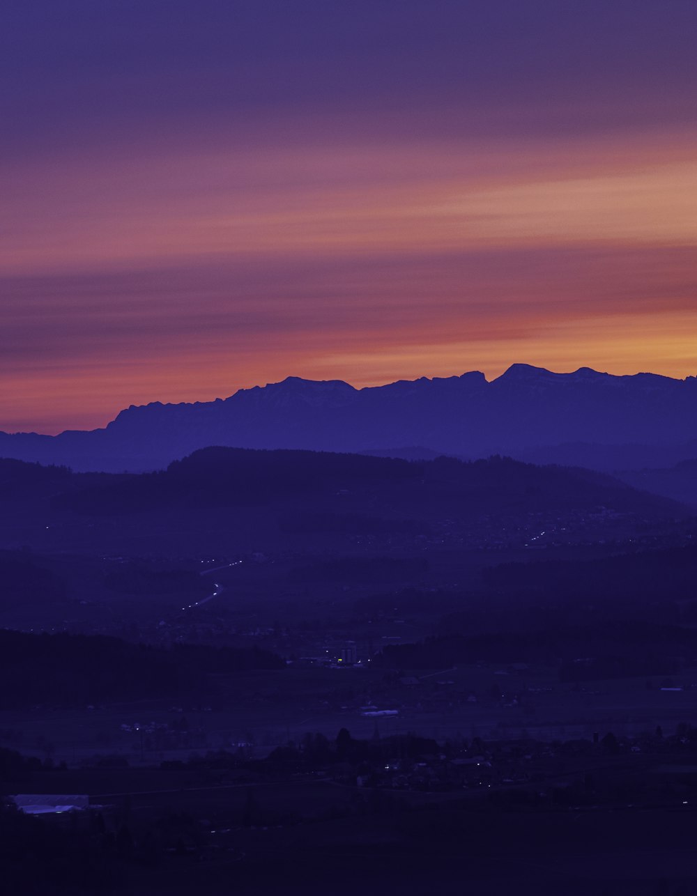 silhouette of mountains during sunset