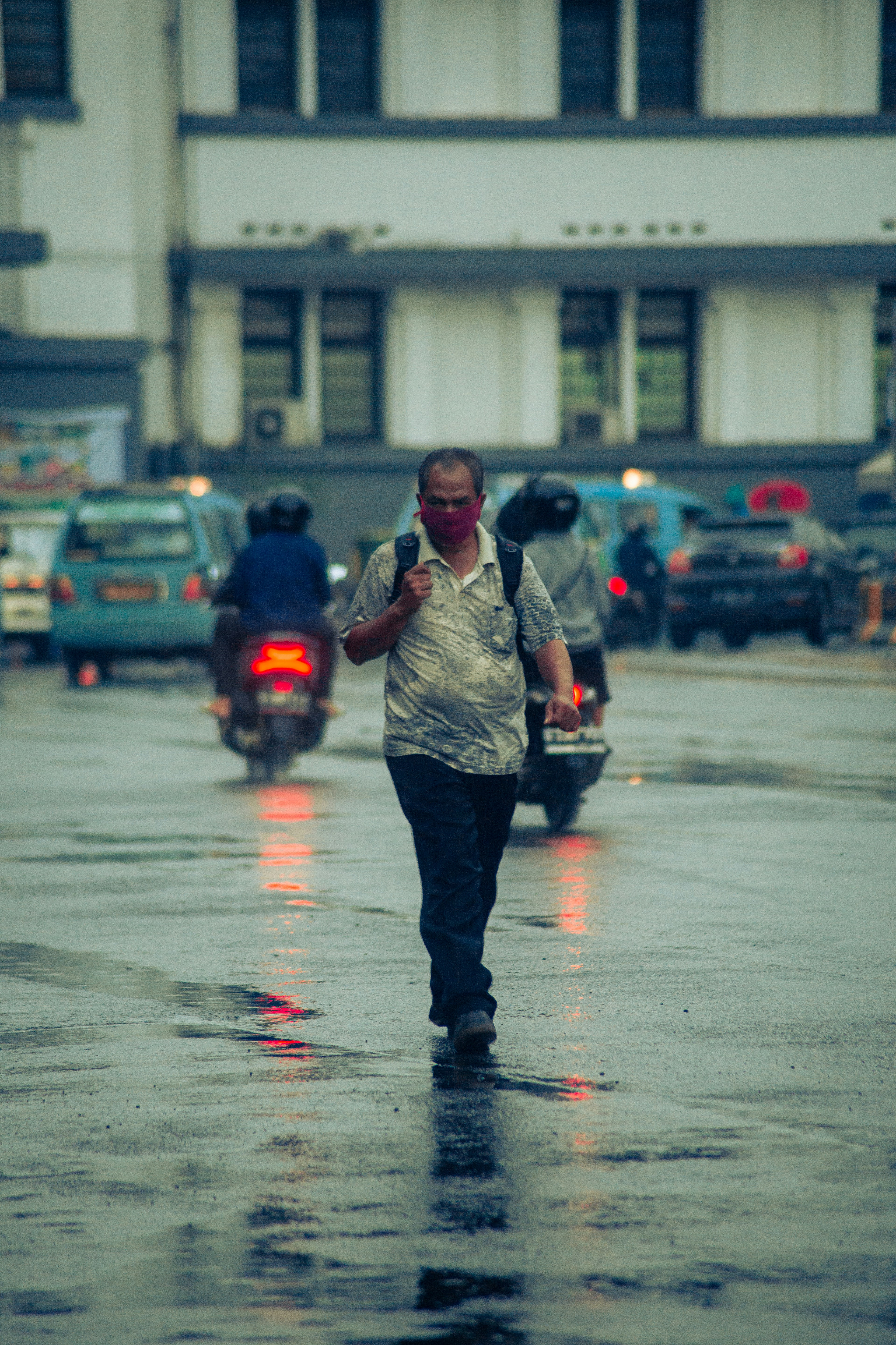 man and woman standing on road during daytime