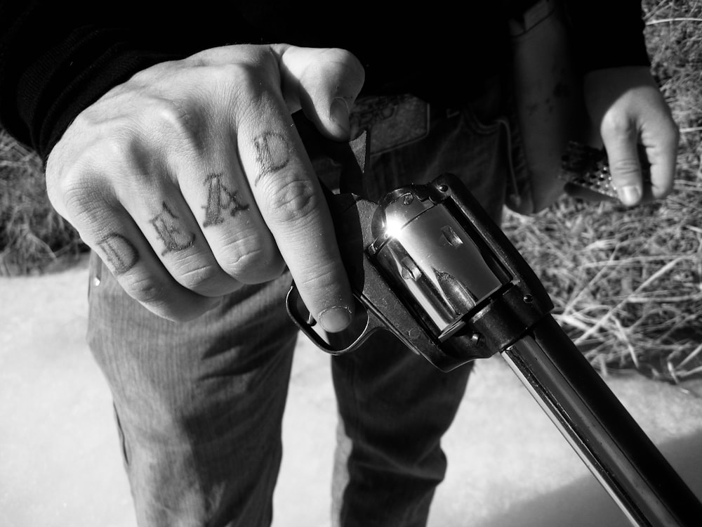 person holding black and silver dslr camera