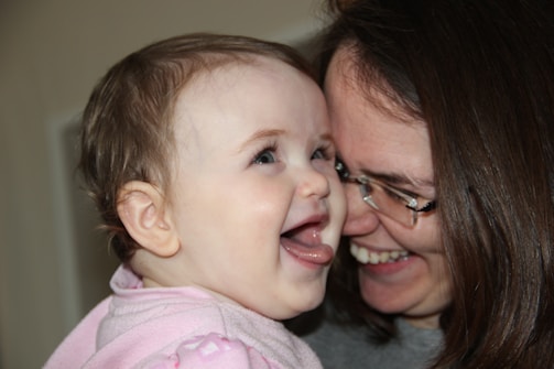 A heartwarming image of a child and a caregiver sharing a joyful moment.