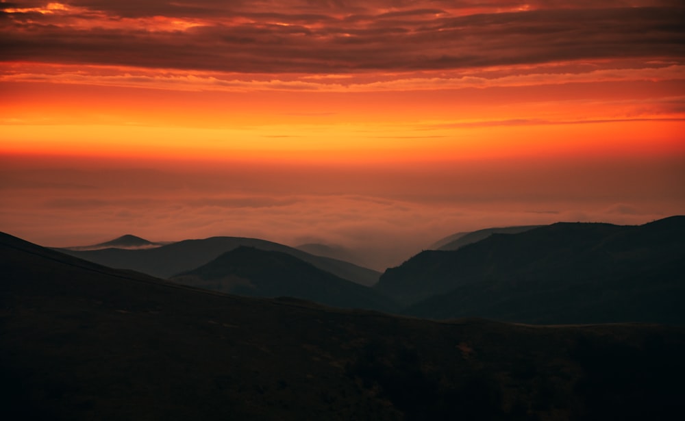 silhouette of mountains during sunset