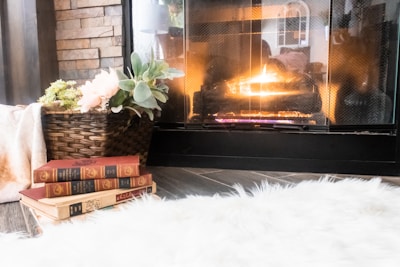 A cozy living room with a fireplace and warm decor.