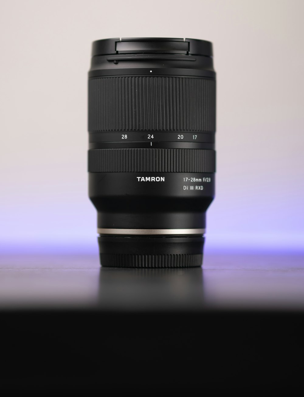 black camera lens on white surface