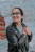 woman in black leather jacket wearing black framed eyeglasses