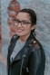 woman in black leather jacket wearing black framed eyeglasses