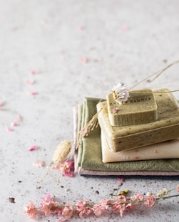 brown and beige cake on white and pink floral textile