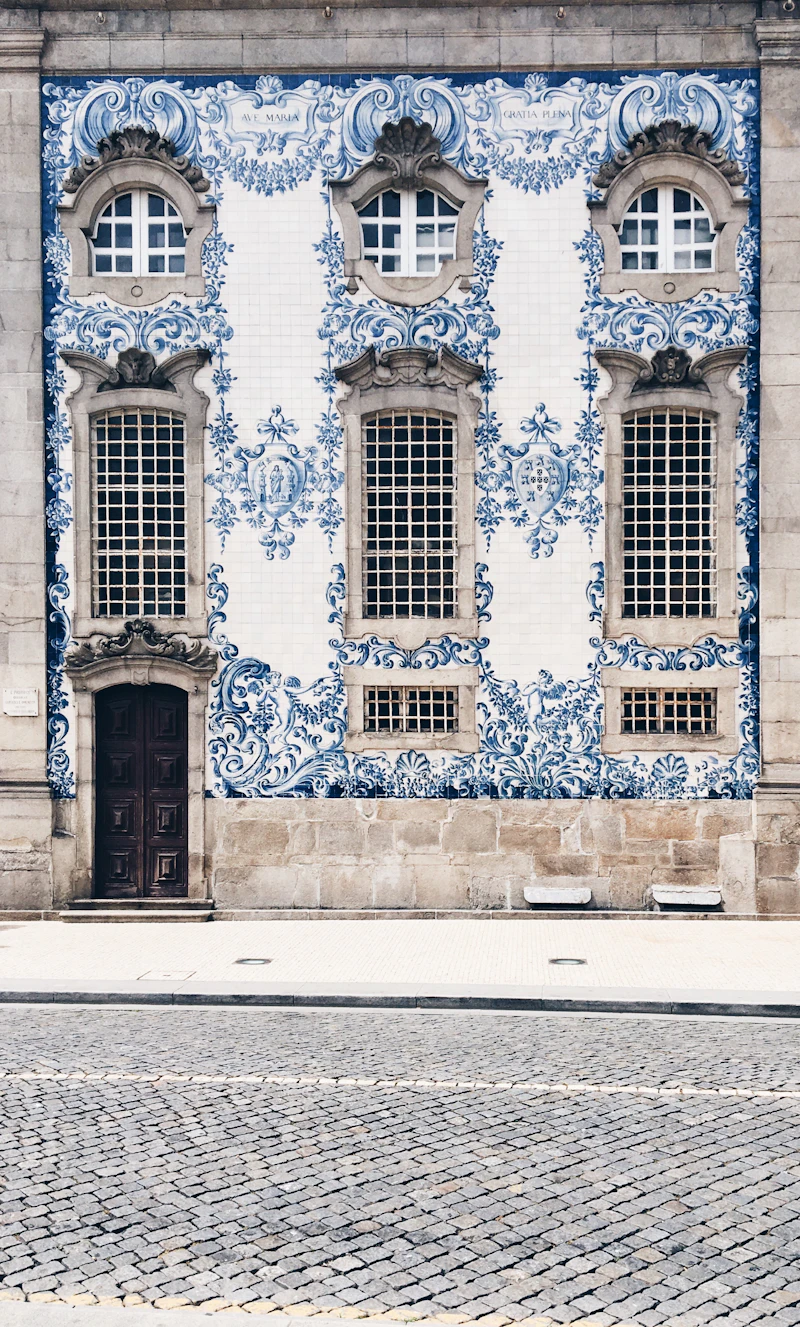 Blue and white azulejo tiles covering a church facade in Porto