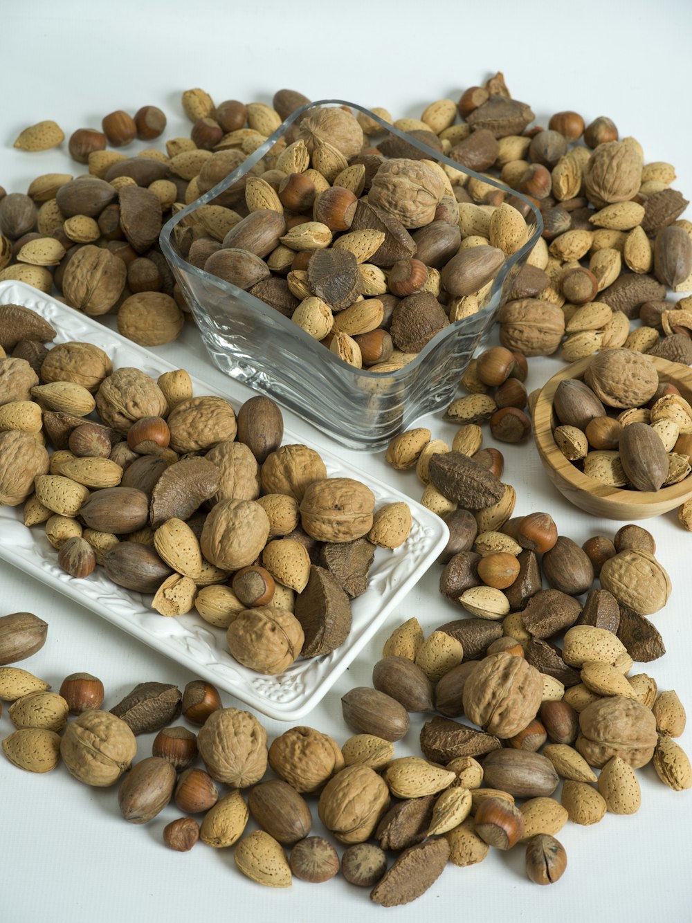 brown almond nuts on white plastic container