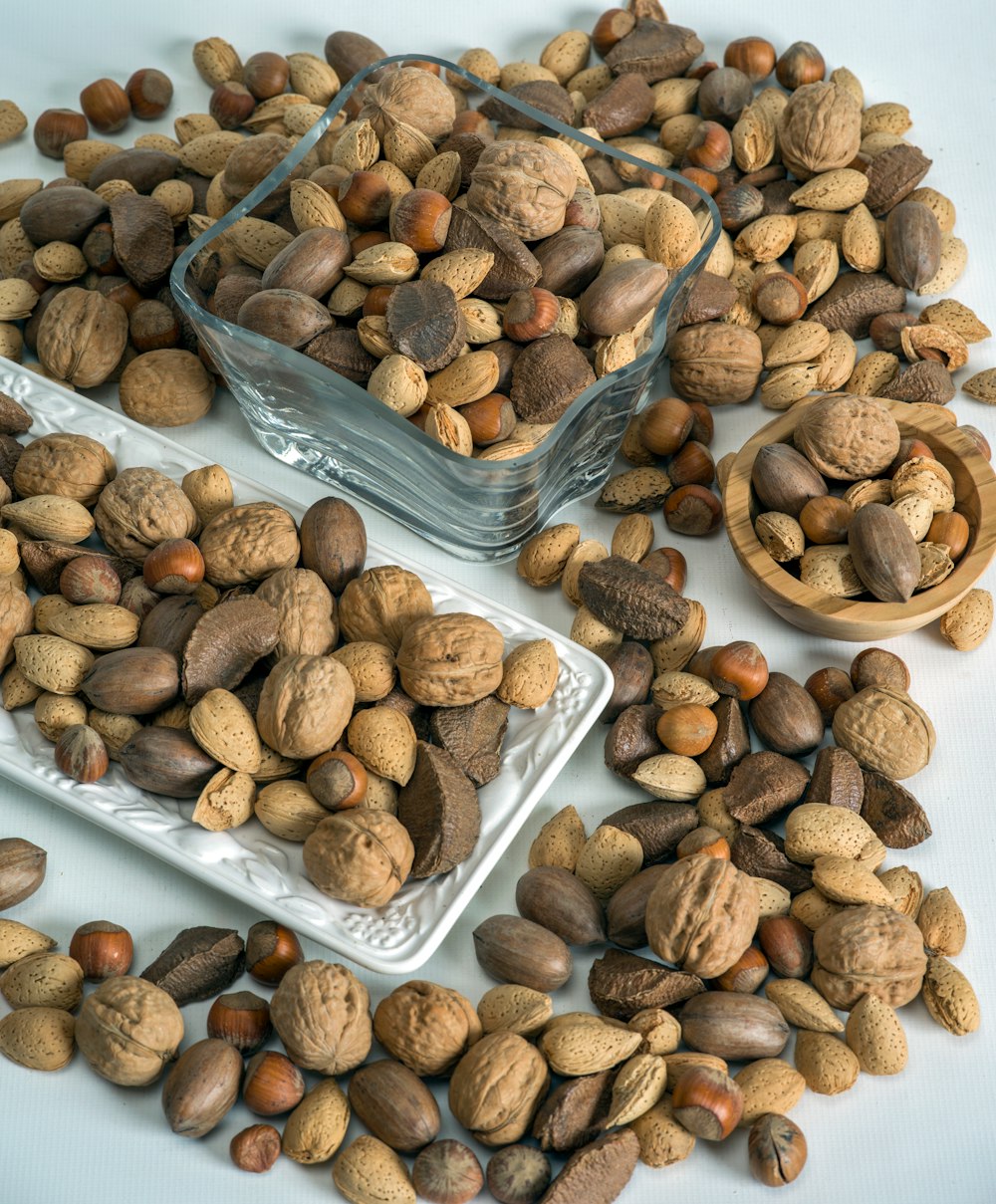 brown and black nuts on clear plastic container