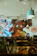 A colorful mural covering a cafe wall with lively, artistic patterns and warm lighting.
