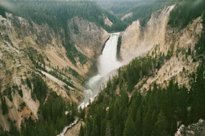 The vibrant Grand Canyon of Yellowstone with its colorful rock walls and cascading waterfall