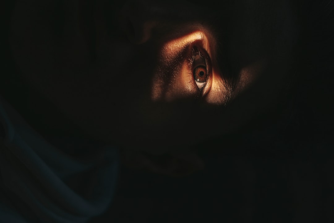 womans face in dark room